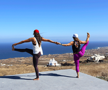two girls yoga santorini