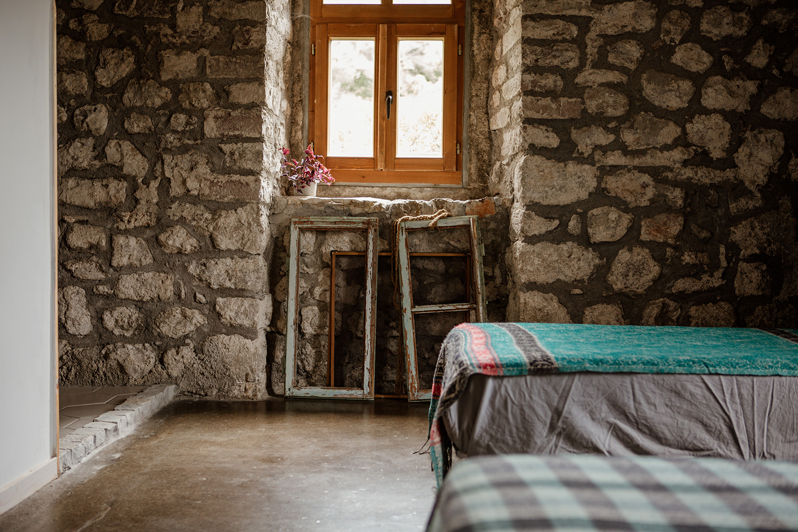 single bed ends window brick wall - hiking yoga holiday montenegro