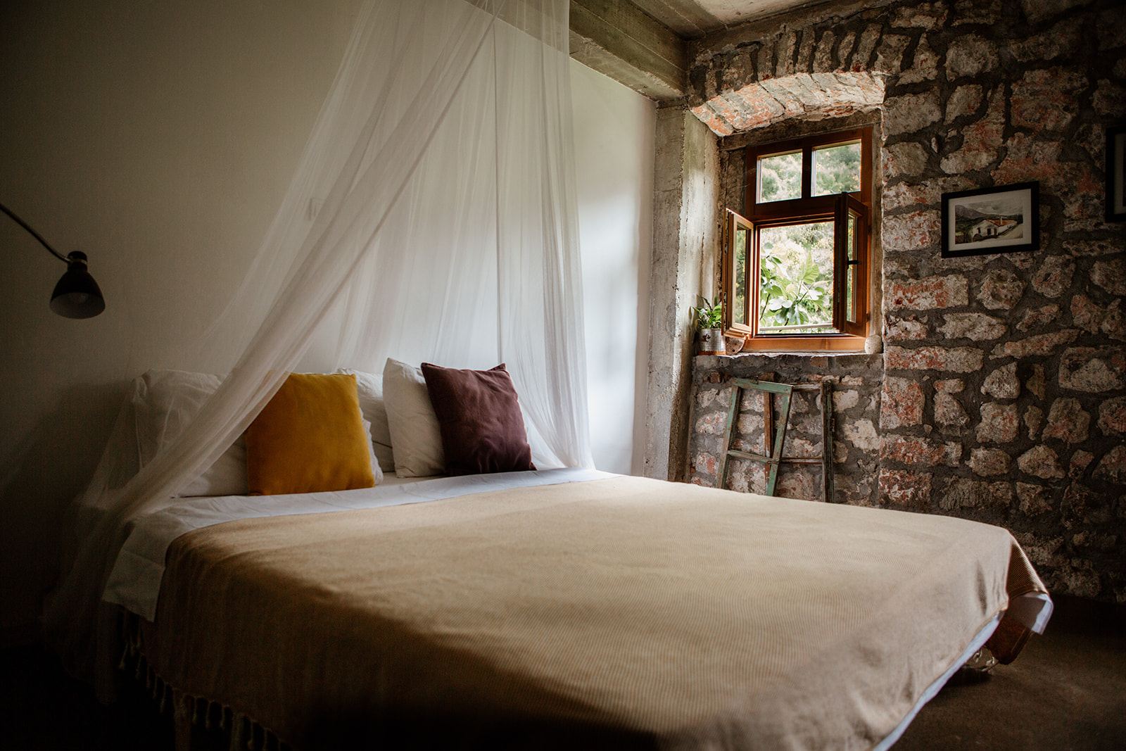double bed stone wall and window yoga holiday montenegro
