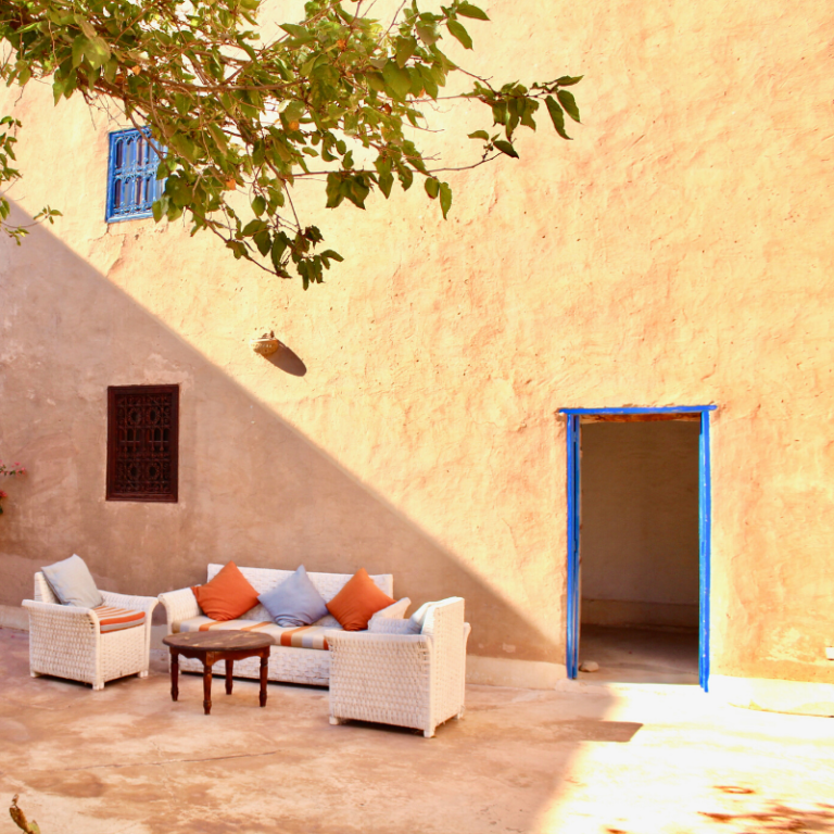 sofa and cushions in morrocan style courtyard yoga holiday Marrakech