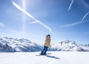 a person skiing with views of the french alps