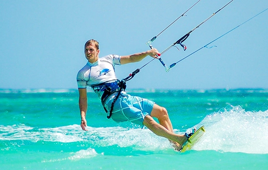 man kite surfing