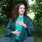 melanie may yoga teacher meditating outside