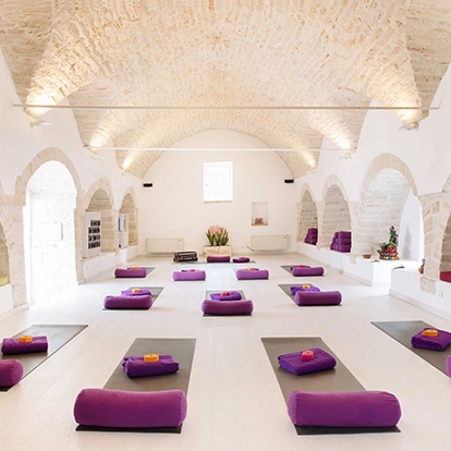 yoga studio with white stone walls