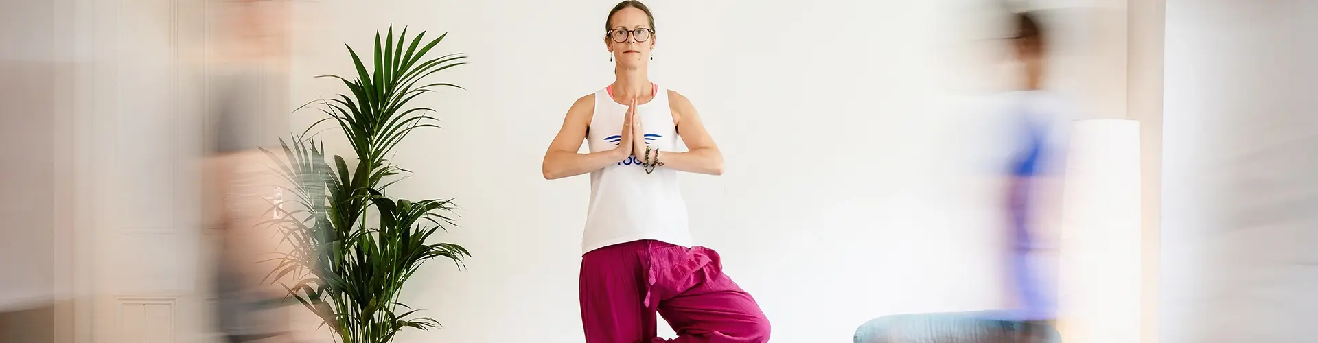 natasha lincoln doing yoga pose for class students