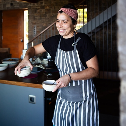 chef bringing out bowls to serve food