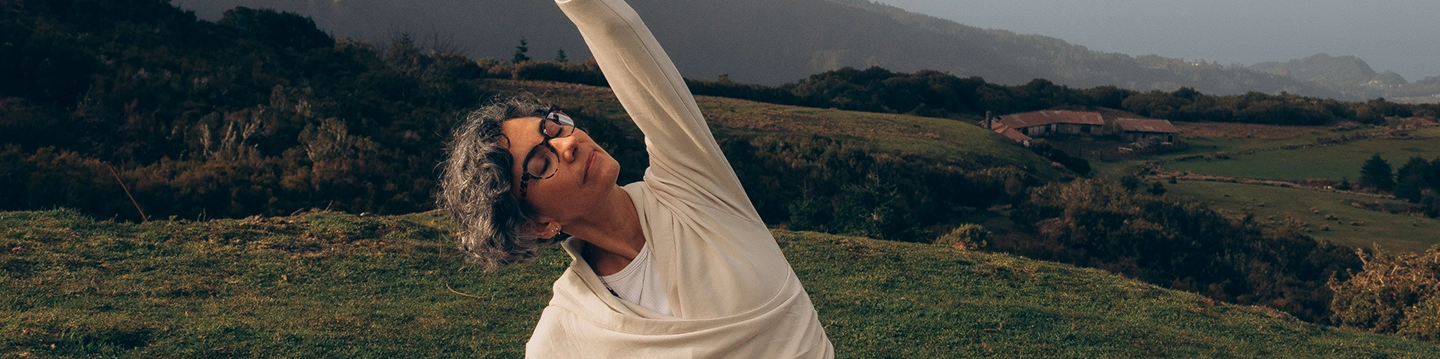 melanie louise yoga teacher on the grass
