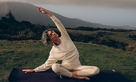 melanie louise doing yoga stretch in nature