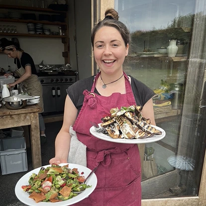 grace frain vegan chef with dishes