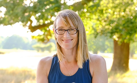nicky dye yoga teacher smiling to camera outside