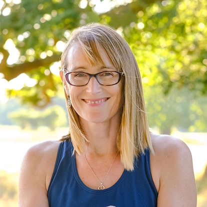 nicky dye yoga teacher smiling to camera